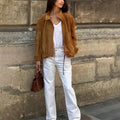 Solid colour loose-fit retro jacket with long sleeves on a model