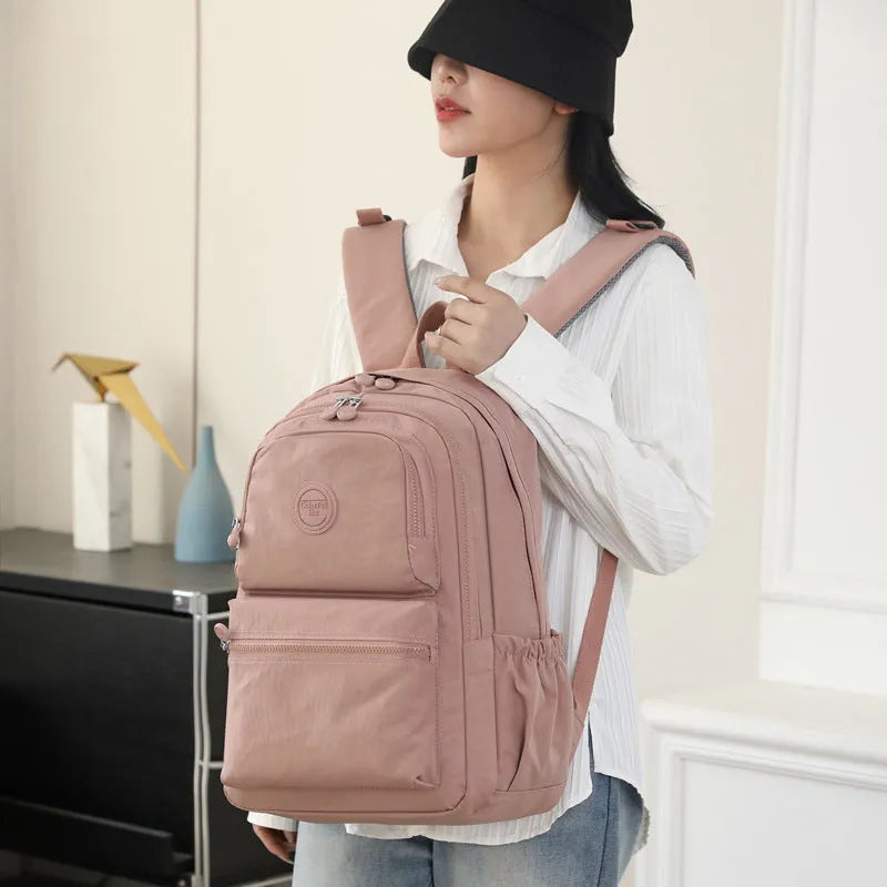 Women's large capacity multi-layer travel backpack in Zhu Mo Black, made from waterproof nylon