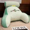 Triangle PP cotton reading cushion for lumbar support on a sofa with solid colour cover
