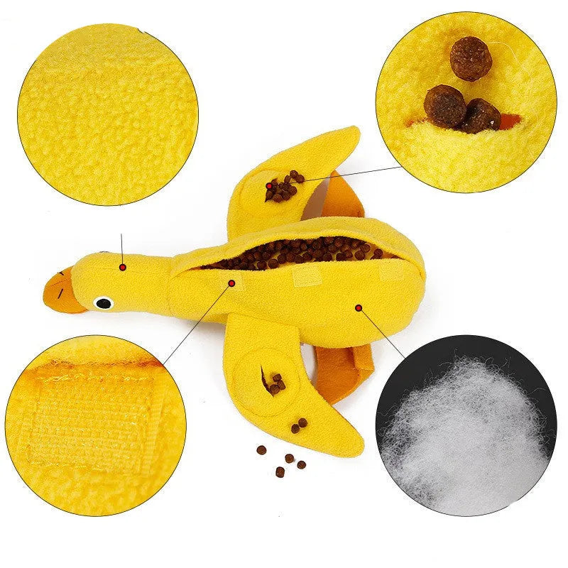 Yellow plush teddy duck dog toy with sound mechanism and treat leak hole for pet training