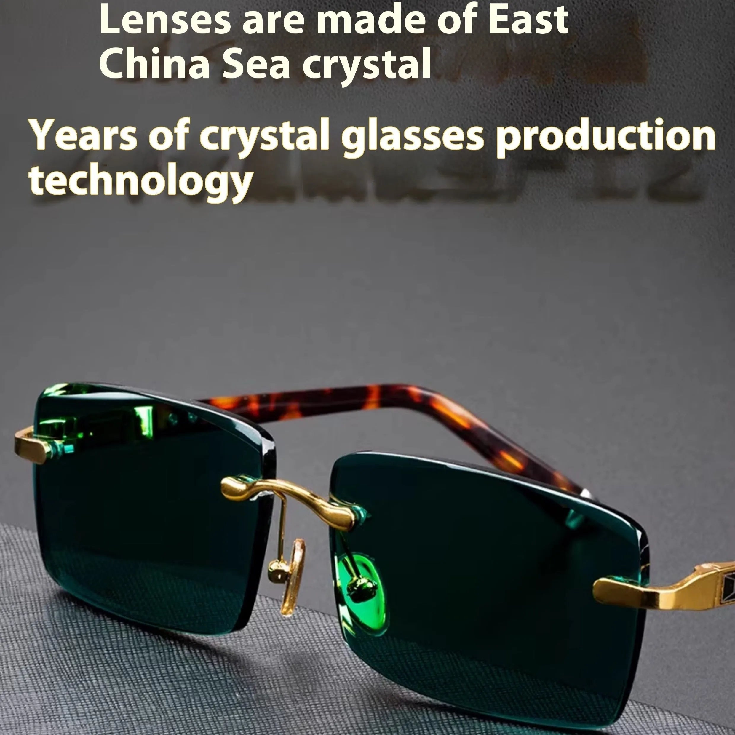 A pair of frameless rectangular sunglasses with dark green crystal lenses, a case, and a lens cloth.