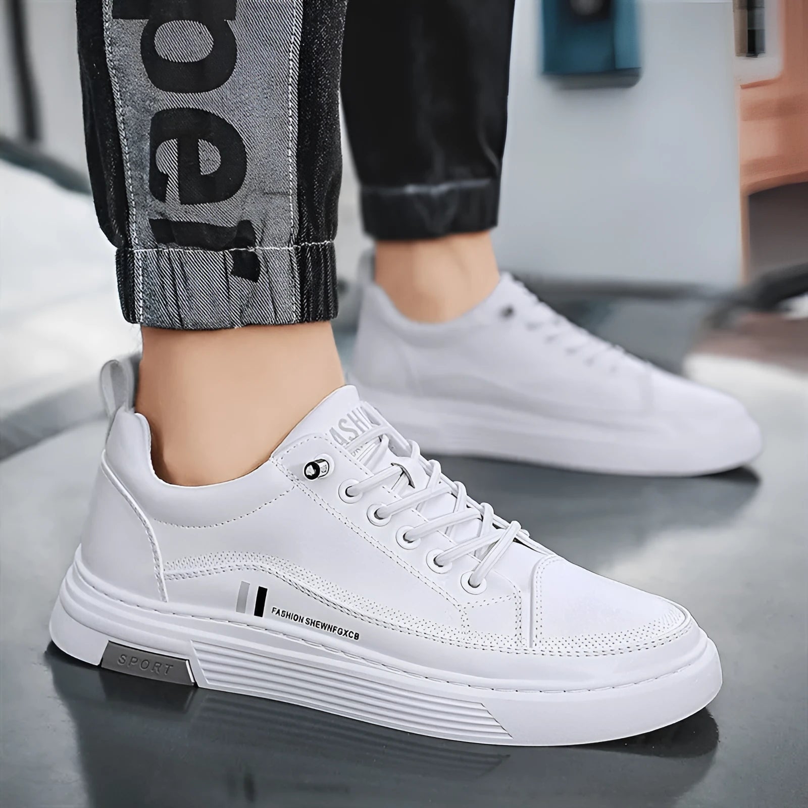 Men's white low-top skate shoes with an elastic band and round toe, on a rubber sole.