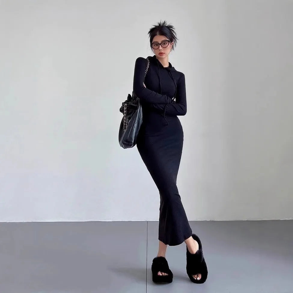 Women's grey hooded long-sleeve sheath dress with a high waist on a model