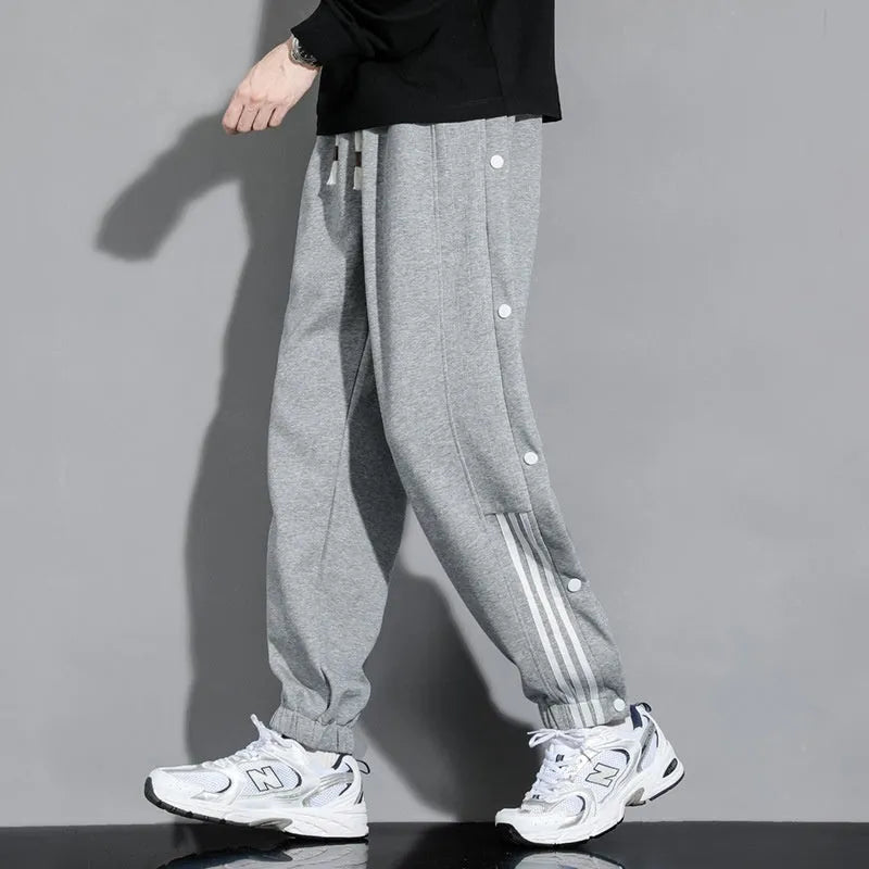 Men's loose grey ankle-tied sports sweatpants with drawstring waist