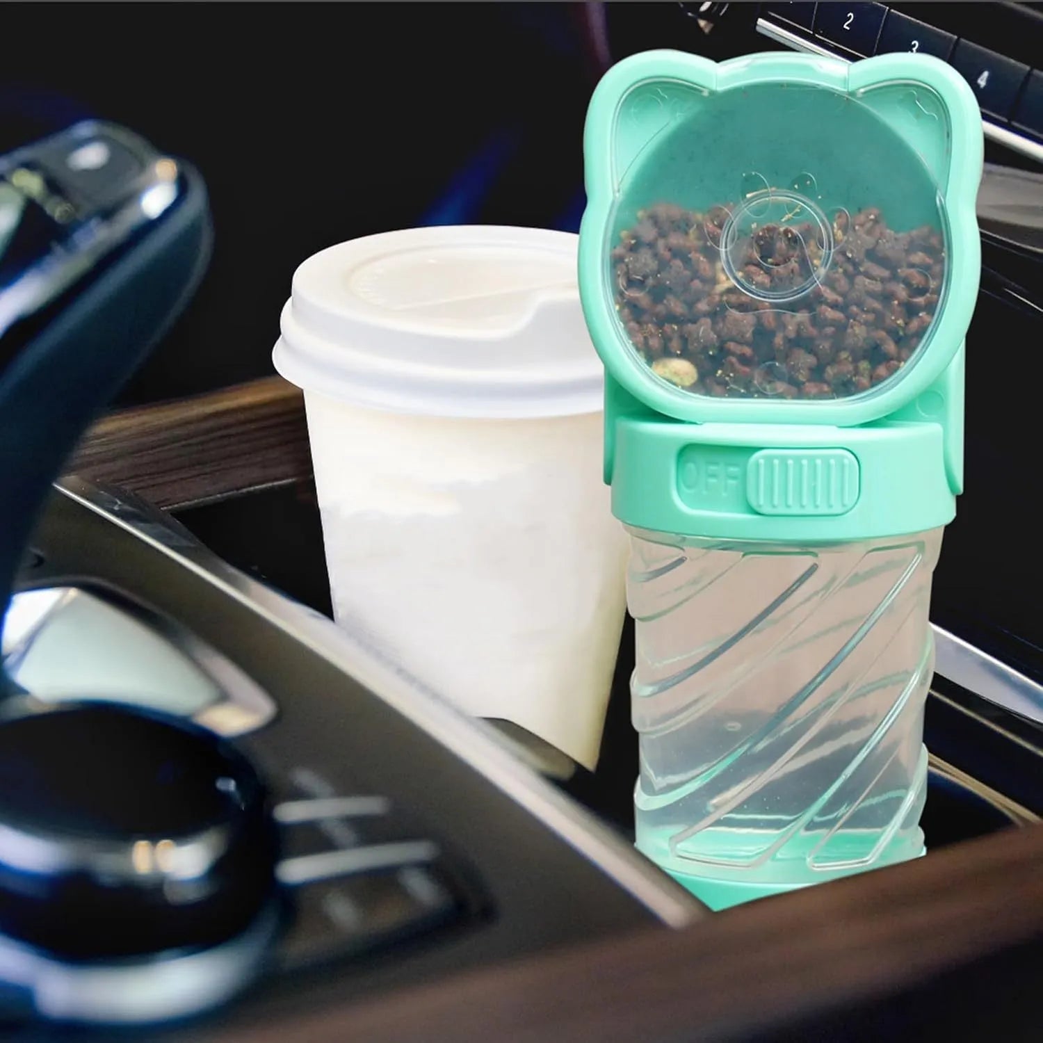 Green 3-in-1 portable pet water bottle with strap, showing water bowl, food container, and bag dispenser.