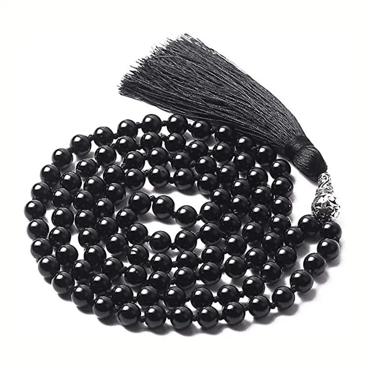 Long agate and amethyst tassel necklace with geometric beads in multiple colours on a 95-100cm chain.