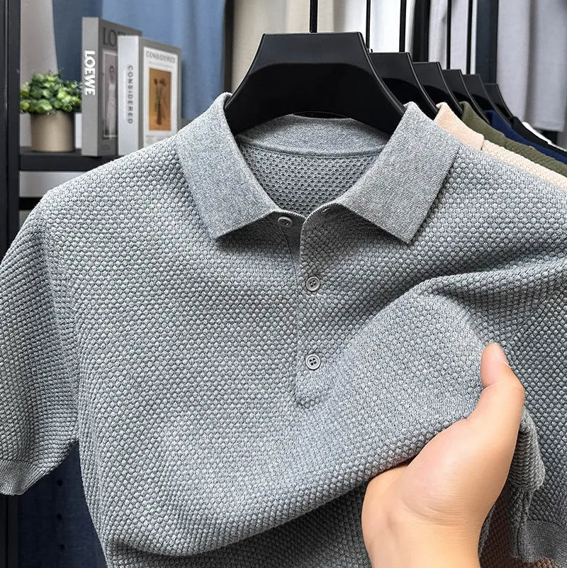 Loose pure cotton short sleeve pullover sweater in grey, shown laid flat.