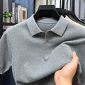 Loose pure cotton short sleeve pullover sweater in grey, shown laid flat.