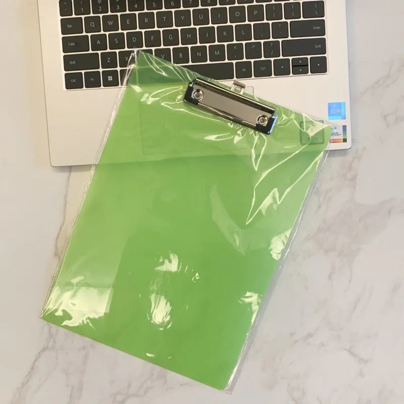 Transparent plastic A4 plate holder with metal clip and integrated writing board surface, shown in blue.