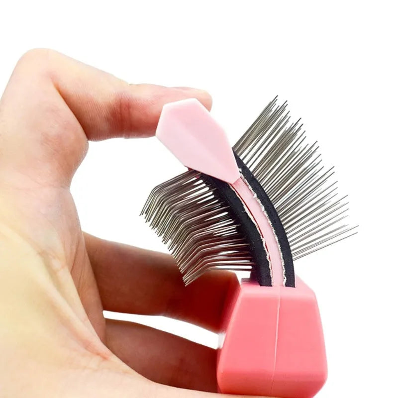Blue double-sided pet brush with stainless steel pins and ergonomic grip on a white background