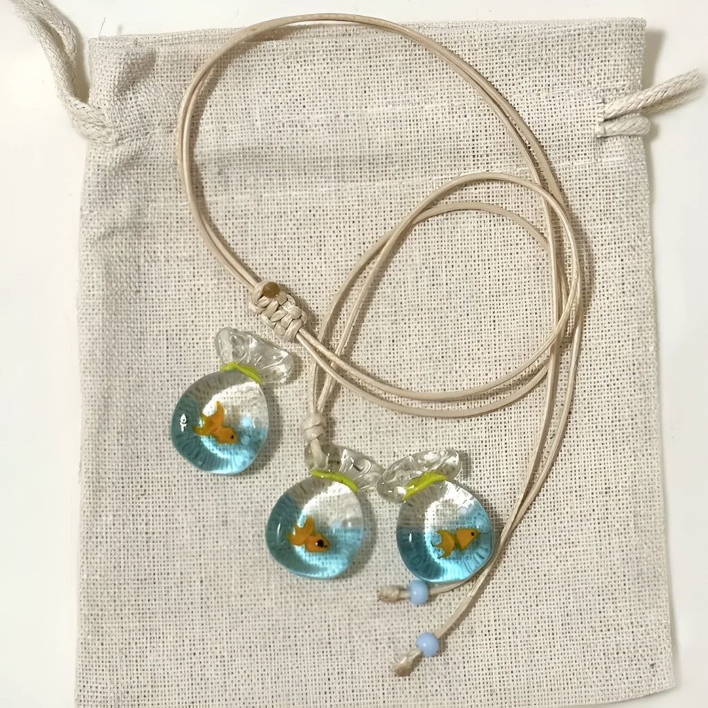 Women's necklace with a coloured glaze Joker pendant wearing a skirt on a cotton and linen chain.