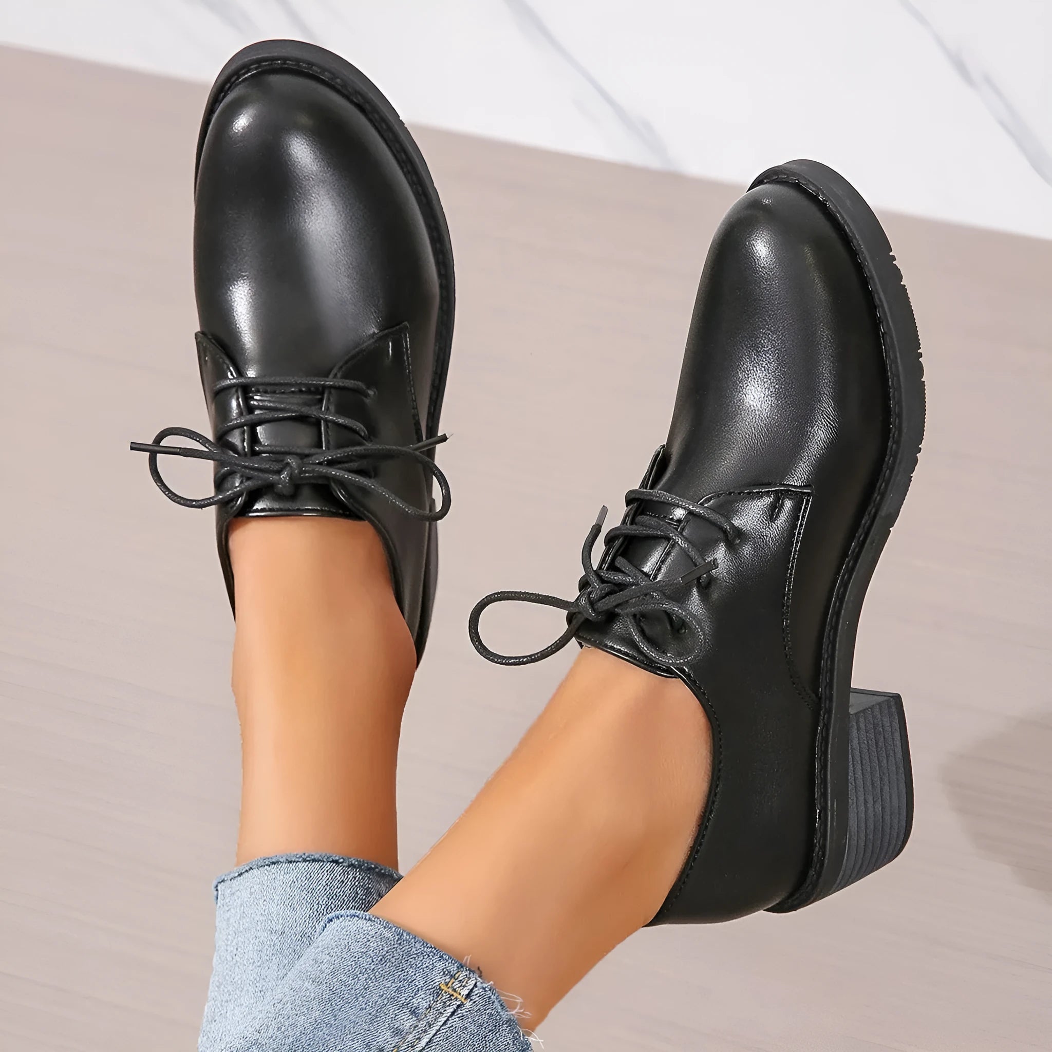 Black women's low-top shoes with a chunky mid-height heel and round toe.