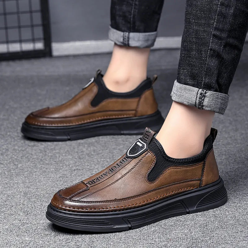 A pair of men's solid colour casual leather shoes with a round toe, shown in black and brown colour options.