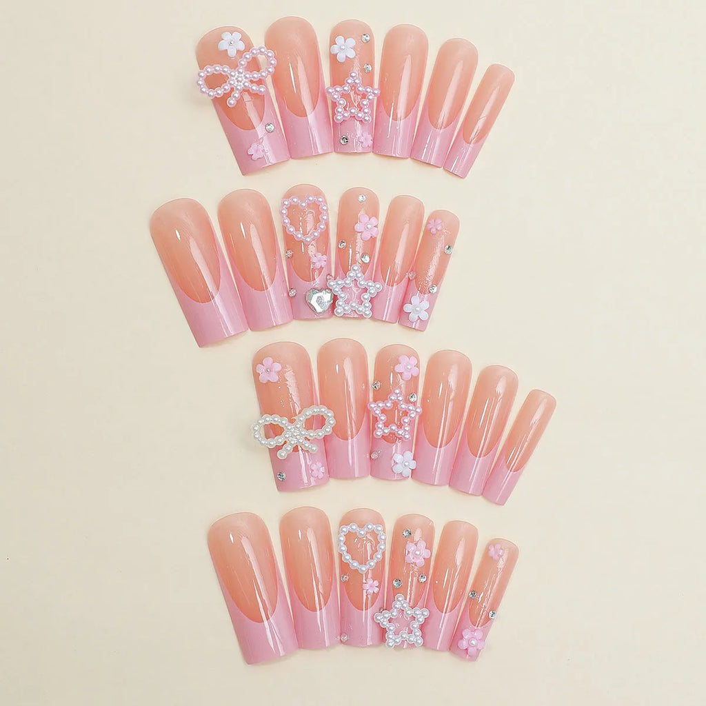 Super long pointed water pipe style false nails with French tip, love heart and bow design in colour XB-70-48.