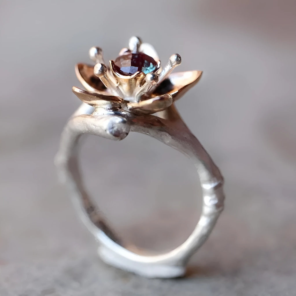 Women's two-tone floral geometric ring in silver alloy material showing size options