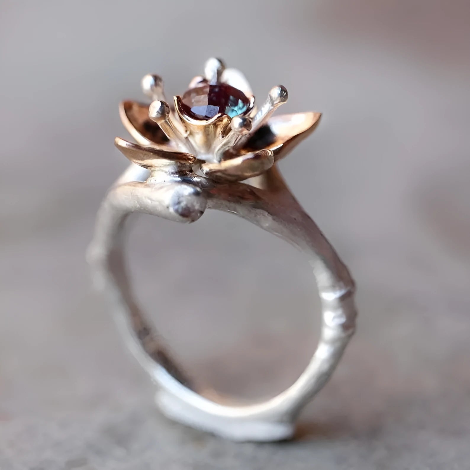 Women's two-tone floral geometric ring in silver alloy material showing size options