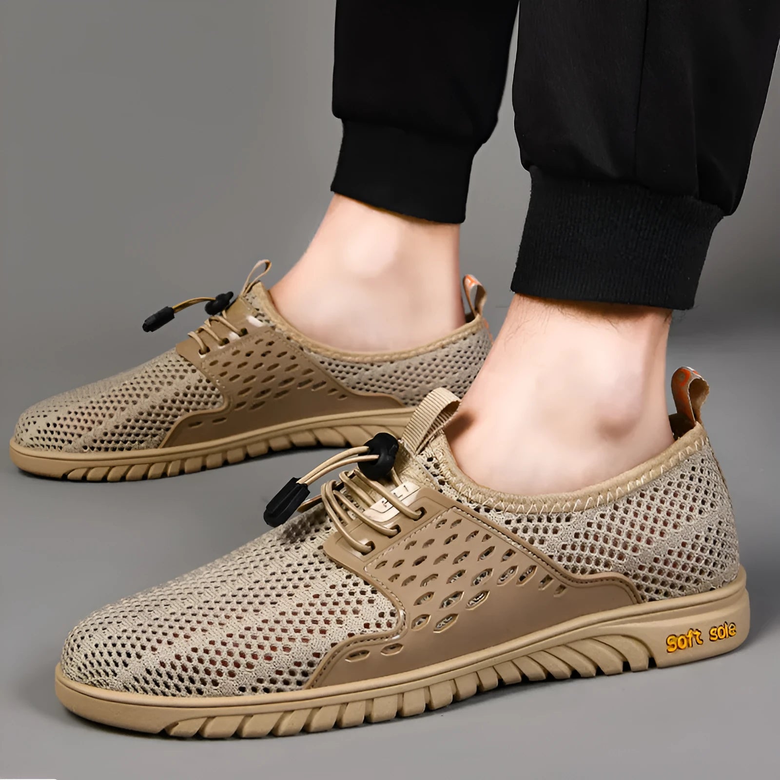 Men's breathable mesh casual shoes with elastic band closure in black, grey or sand colour