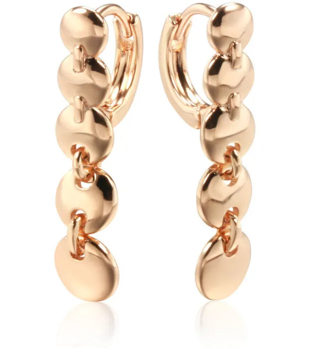 Gold retro long round circle drop earrings with woven wire construction.