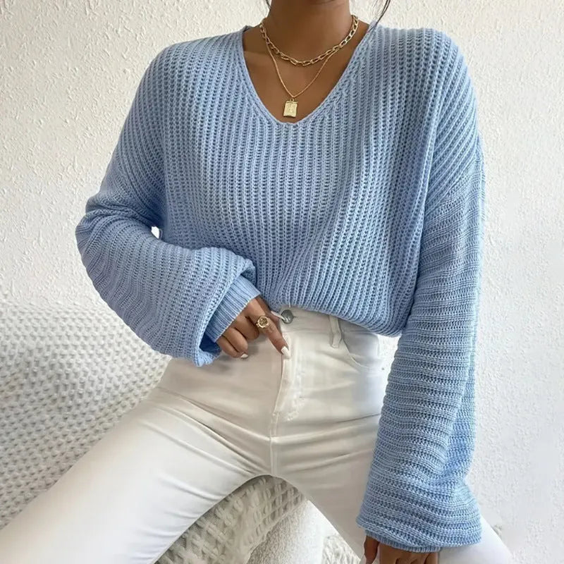Women's solid colour long sleeve pullover in a loose casual fit, shown in one of five colour options.