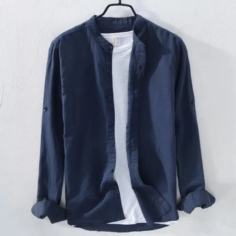 Man's loose-fit long sleeve casual shirt in linen-cotton blend, shown in dark blue colour.