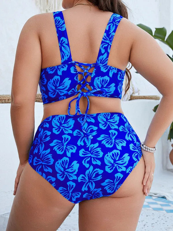 Blue floral print women's plus size bikini swimsuit on a hanger