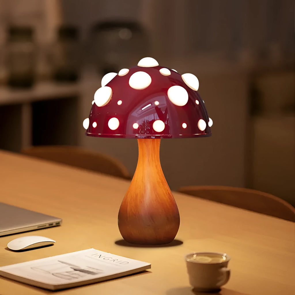 Mushroom decorative table lamp with white base and tricolour light on a wooden nightstand