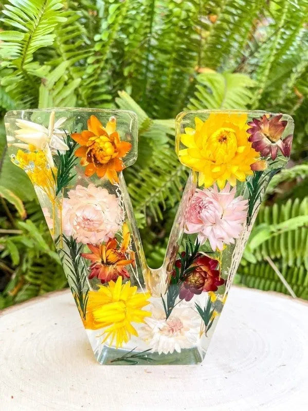 Letter flower transparent resin night light ornament with 15cm dimensions on a table