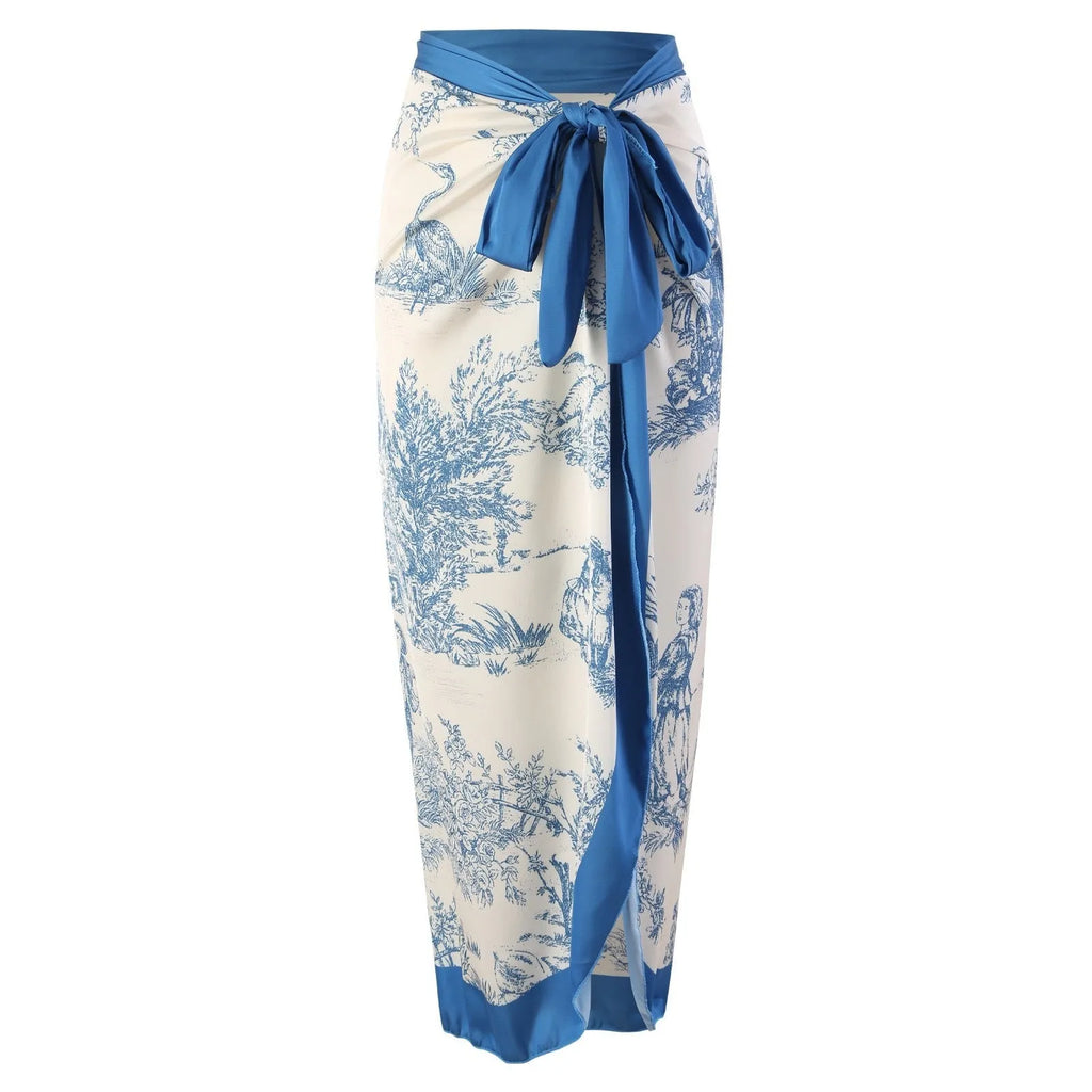 Blue patterned one-piece swimsuit for women with a matching lightweight gauze skirt cover-up.