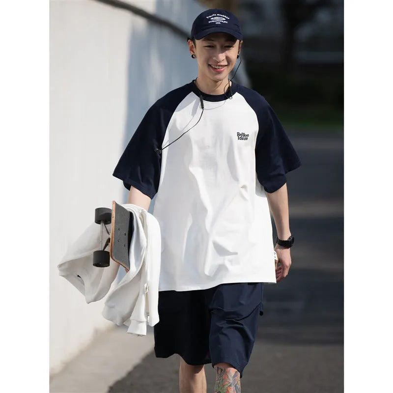 Blue loose-fit men's T-shirt with raglan sleeves in a Japanese Junior casual style.