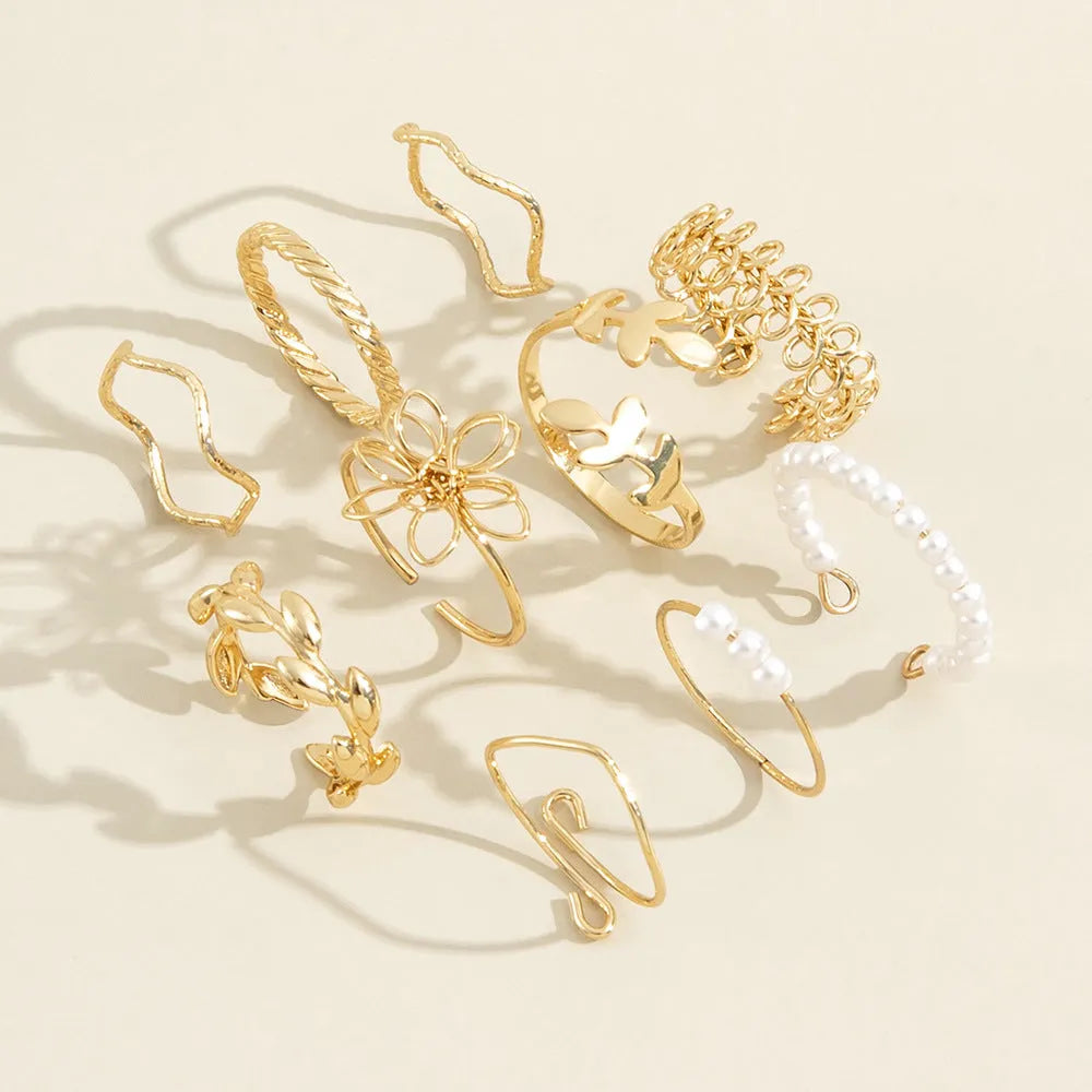Women's openwork flower ring set with glossy gold finish and floral design
