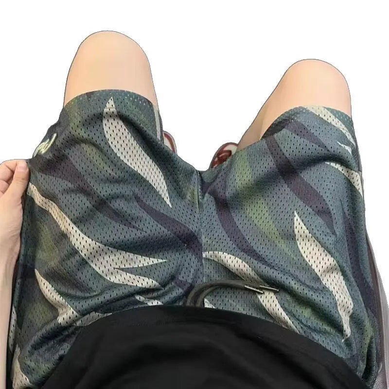 Men's straight-leg camouflage shorts in cotton blend fabric, showing the earthy pattern.