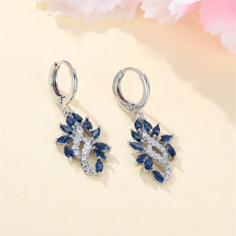 Women's simple minority all-match earrings in platinum sapphire blue alloy on display