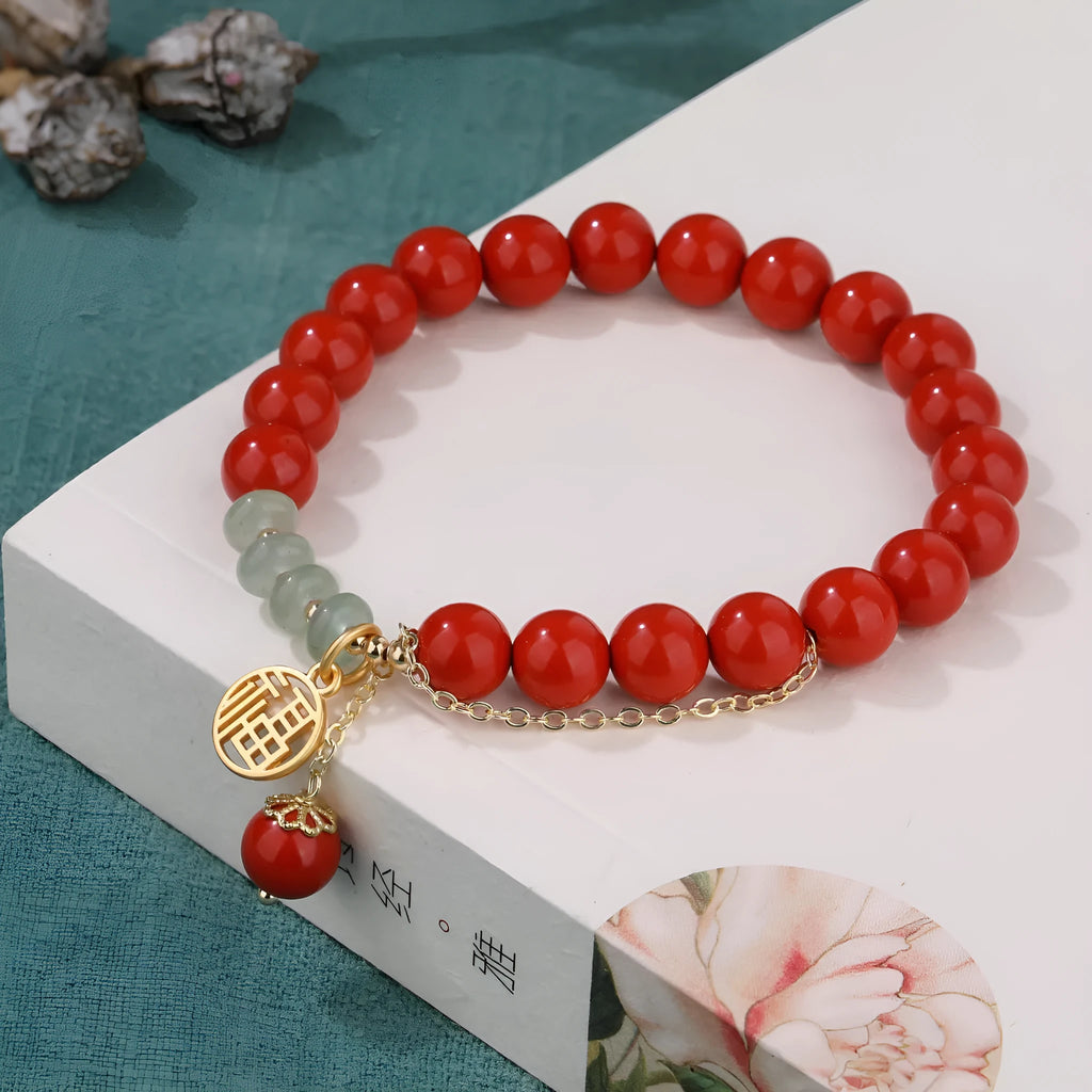 Retro women's red sand cinnabar bracelet with jade spacers and Fu character tassel, 8mm beads