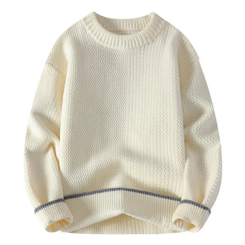 Man wearing a loose grey round neck pullover sweater, casual autumn outfit