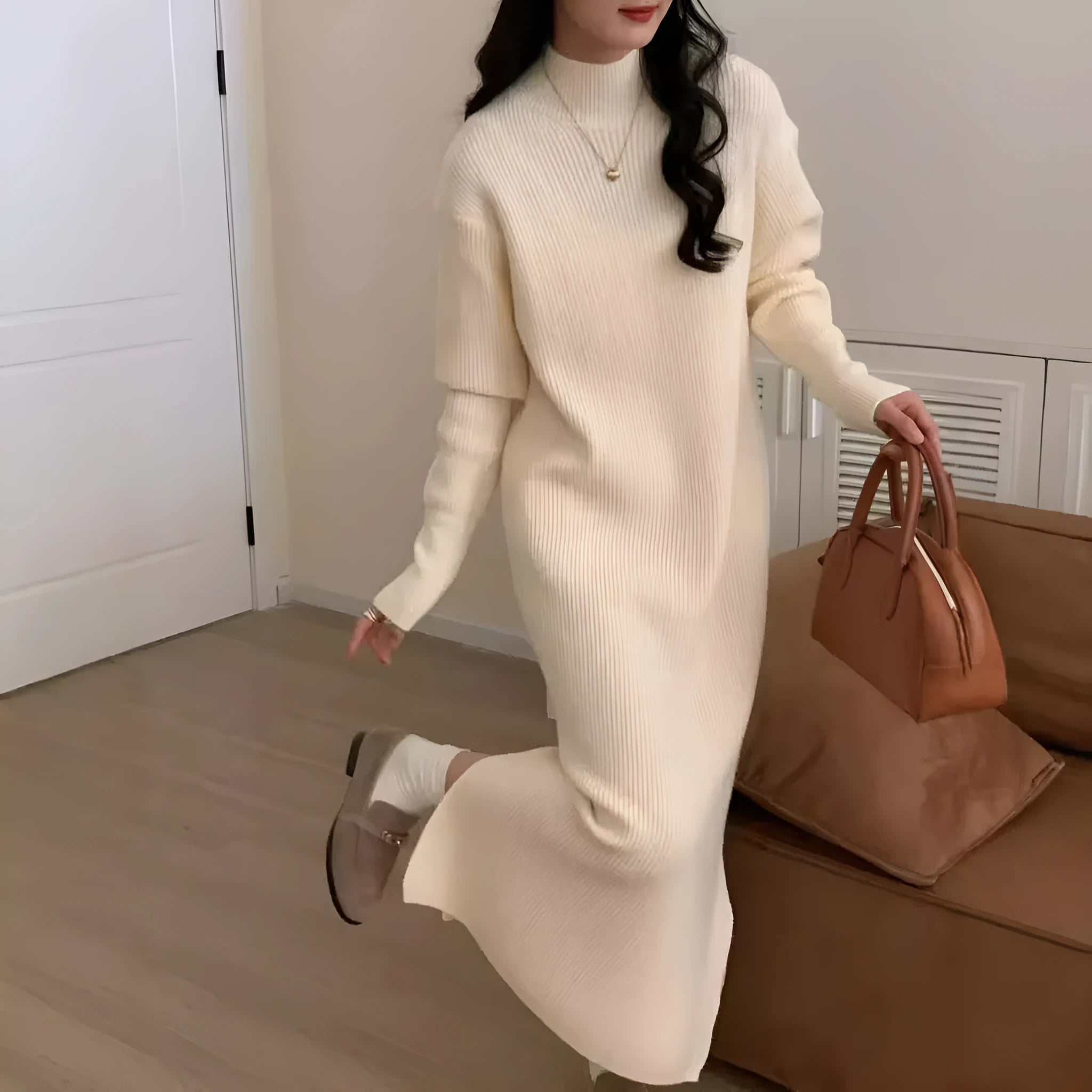 Acrylic knitted half turtleneck dress in beige colour with long sleeves and high waist midi skirt.