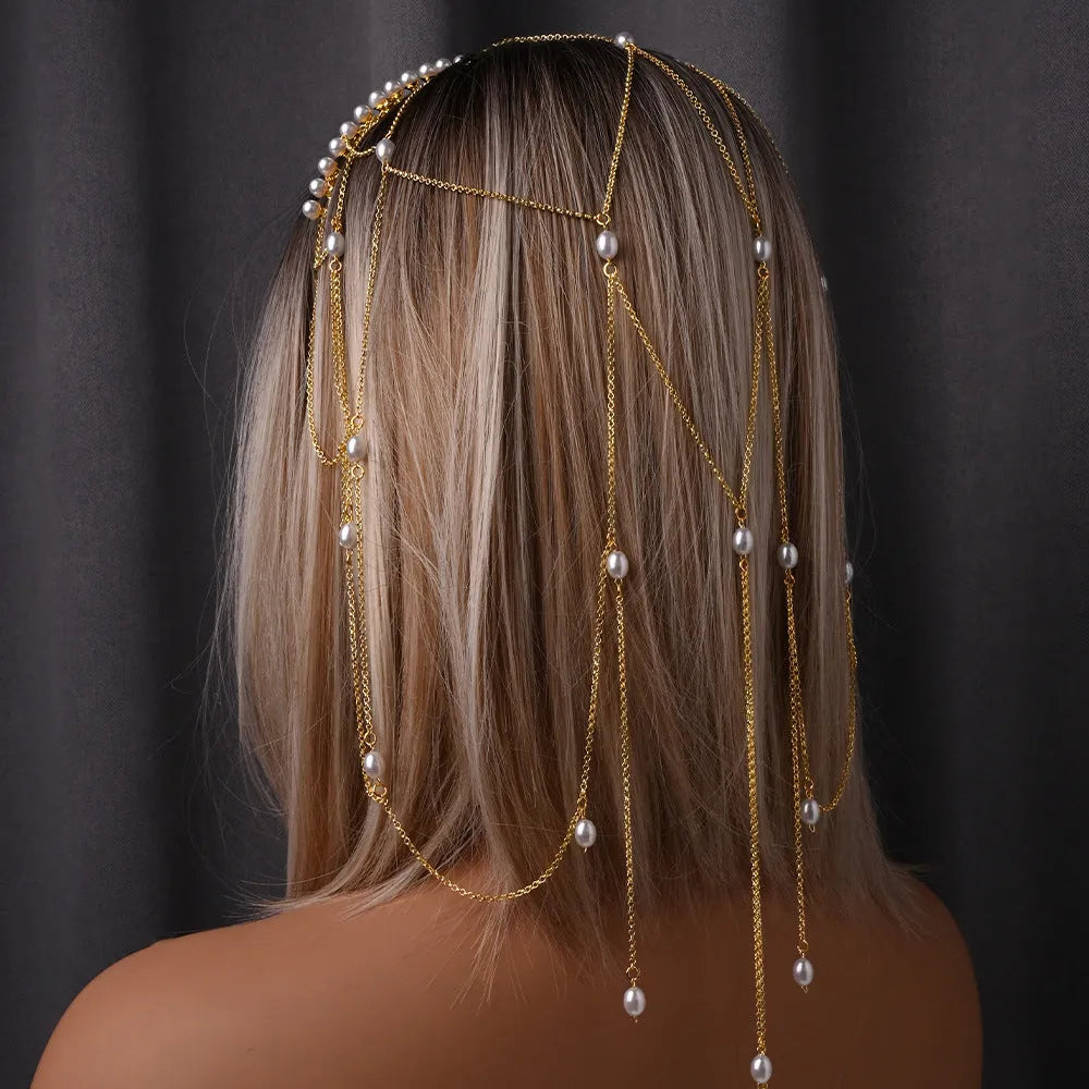 Women's electroplated hair chain with pearl decoration and tassel detailing in gold and silver options