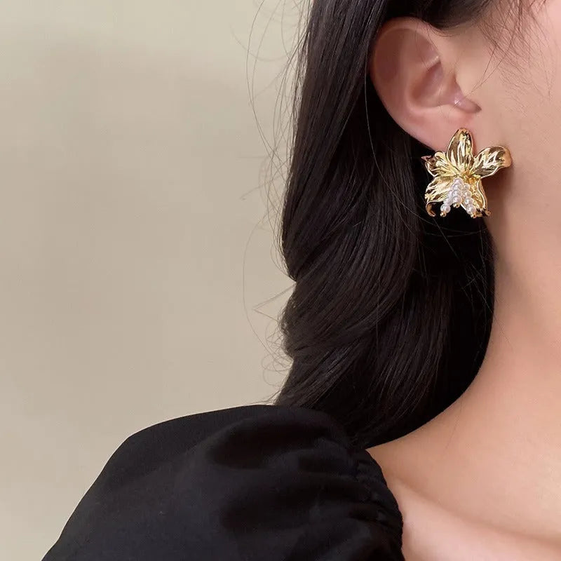 Gold H1795 metal flower earrings with pearl design and Seiko treatment