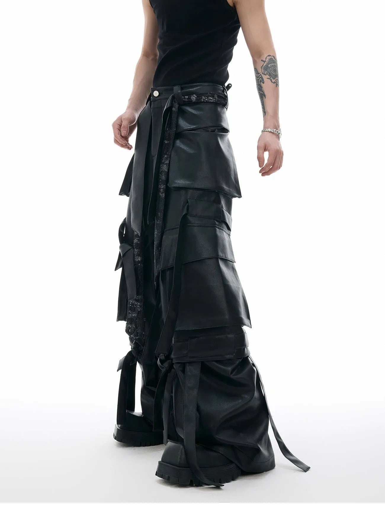 Black men's retro multi-pocket leather trousers with quilted stitching and loose fit.
