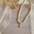 French Court vintage pearl necklace with geometric shapes on electroplated alloy chain showing adjustable length