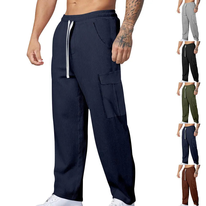 Men's loose-fitting corduroy cargo trousers in navy blue with a drawstring waist and wide straight legs