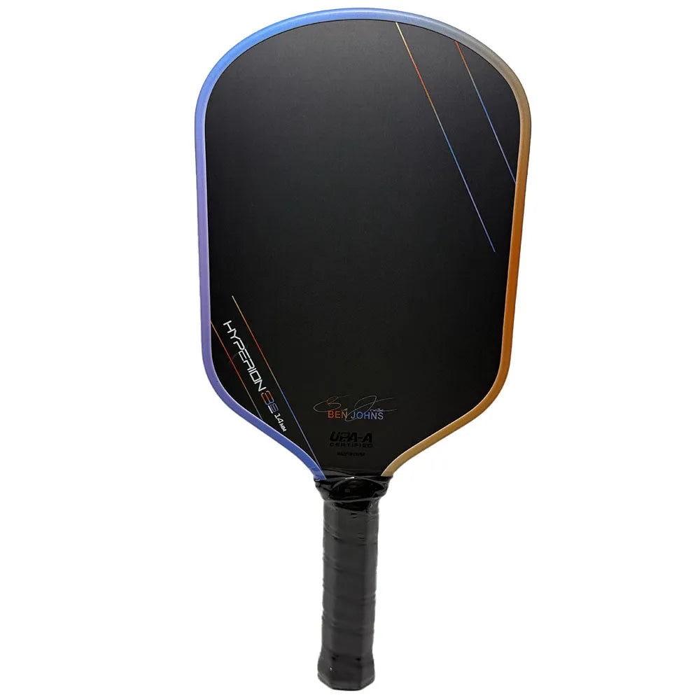 Matte black pickleball racket with Teflon cloth pattern, showing carbon fibre construction and honeycomb core.