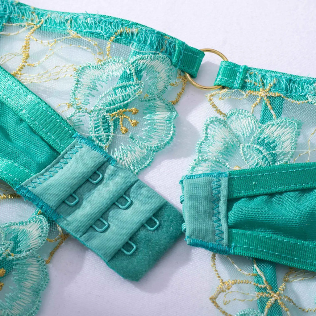 Women's light green polyester embroidered bra set with three-point tights on white background