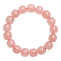 Pink natural crystal barrel bead bracelet with polished 8 x 10mm beads