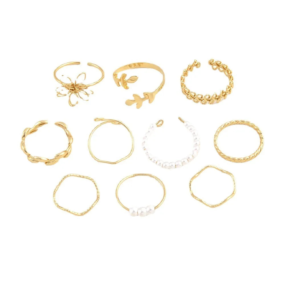Women's openwork flower ring set with glossy gold finish and floral design