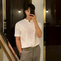 Men's loose thin black Vinylon knit pullover shirt on a hanger