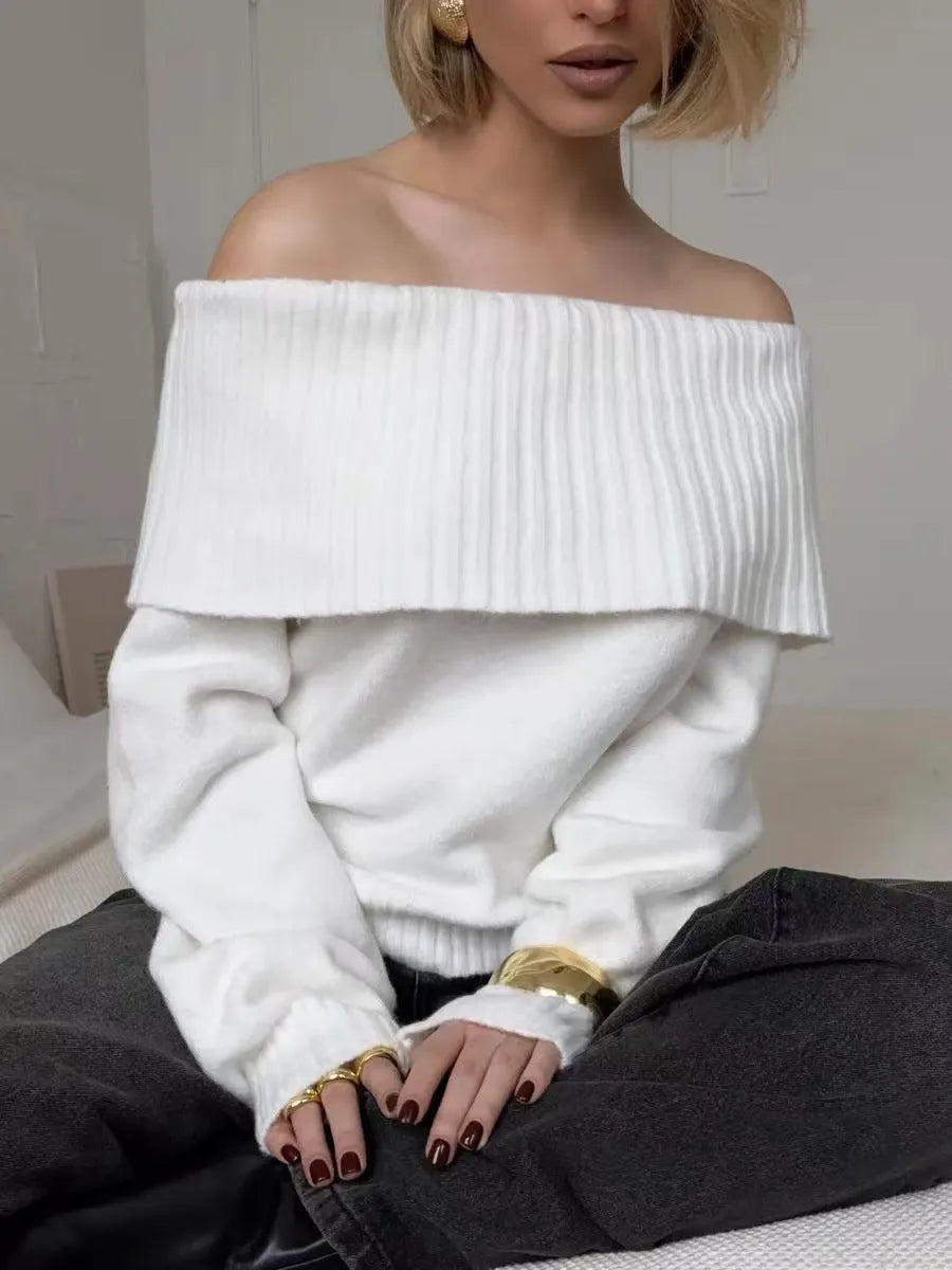 Grey off-the-shoulder acrylic sweater with a 3D pattern texture, modelled from the front.