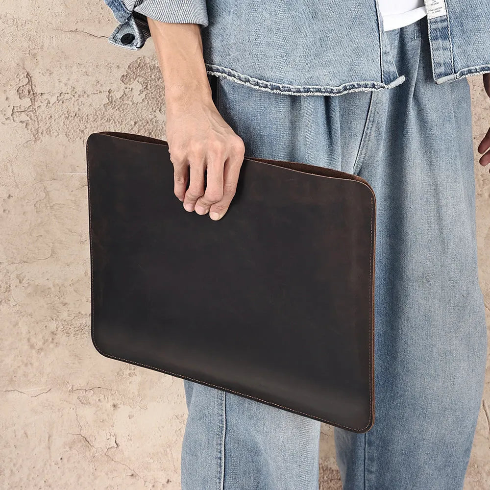 Men's brown Crazy Horse leather horizontal laptop liner bag showing first-layer cowhide texture