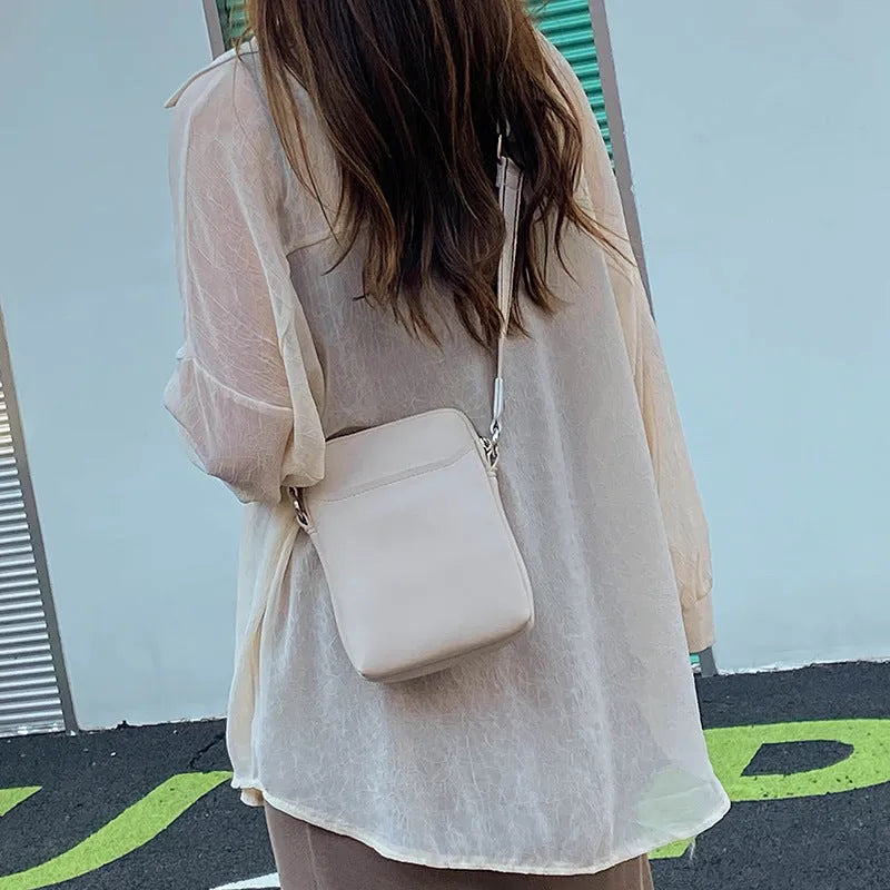 Solid colour mobile phone crossbody shoulder bag showing black, beige, khaki and green options