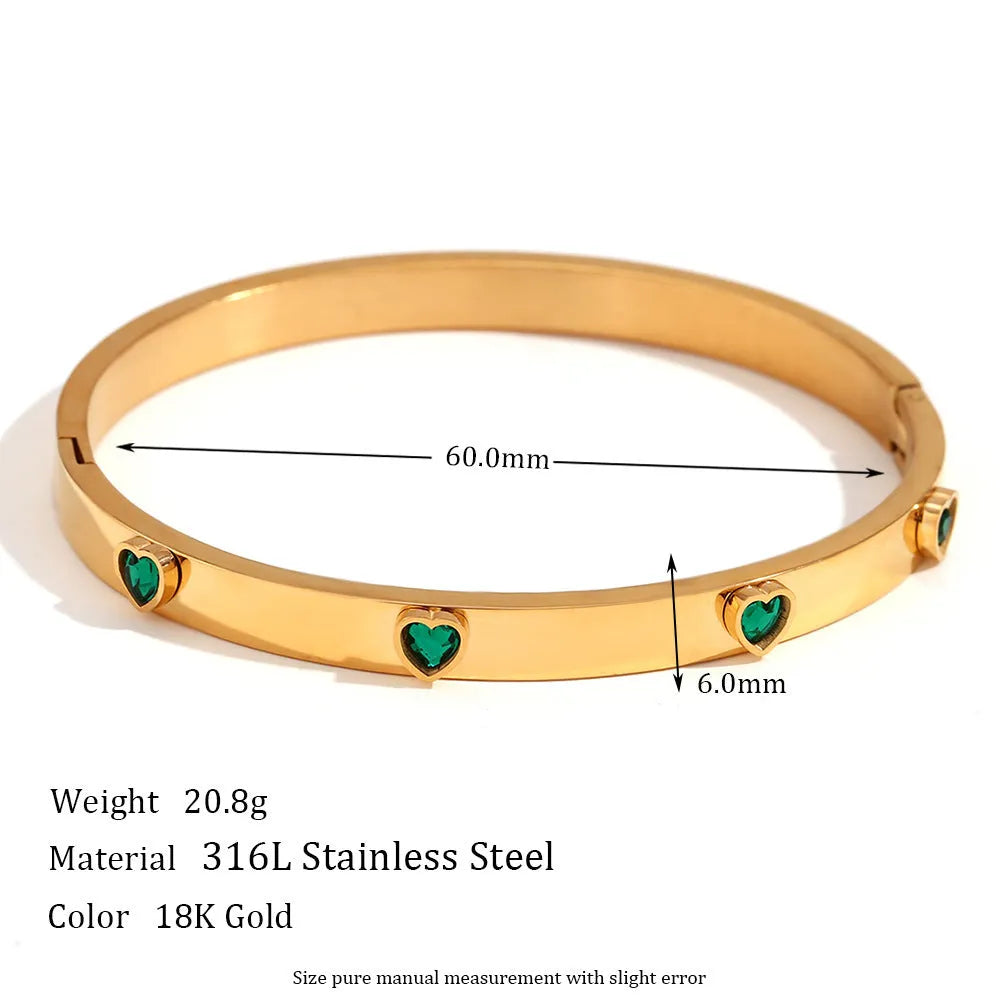 Women's stainless steel bracelet with a micro-inlaid peach heart charm in a golden electroplated colour.