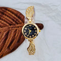 Women's stainless steel watch with round dial on wrist, showing gold surface colour option.
